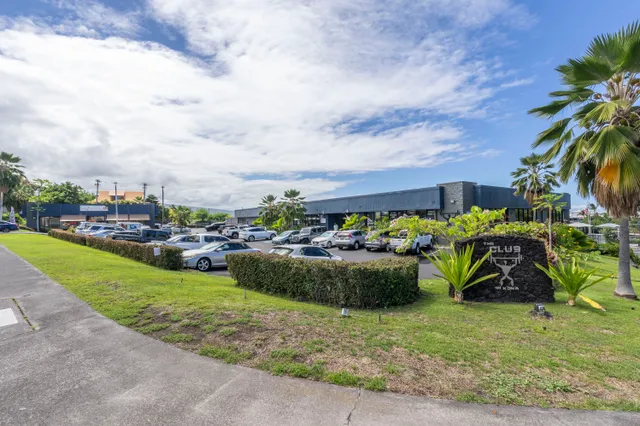 a view of a yard with cars