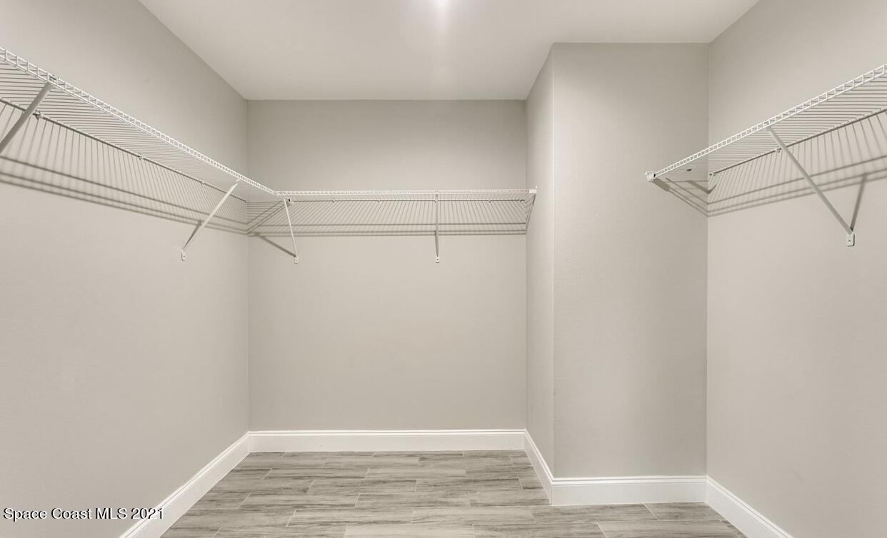 1738 Hydrangea Road Palm Bay, FL 32907 - Photo 17 of 20 a view of a room with racks on the wall