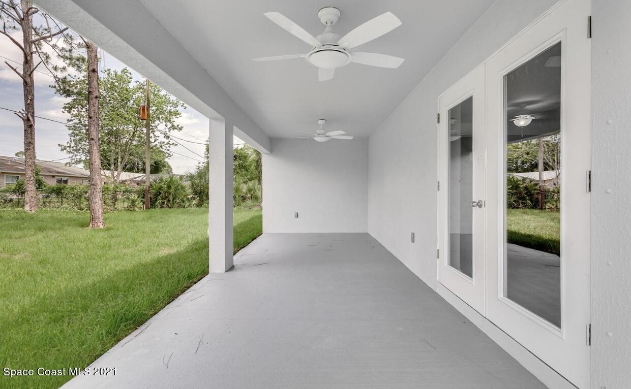 1738 Hydrangea Road Palm Bay, FL 32907 - Photo 20 of 20 a view of a porch with a yard