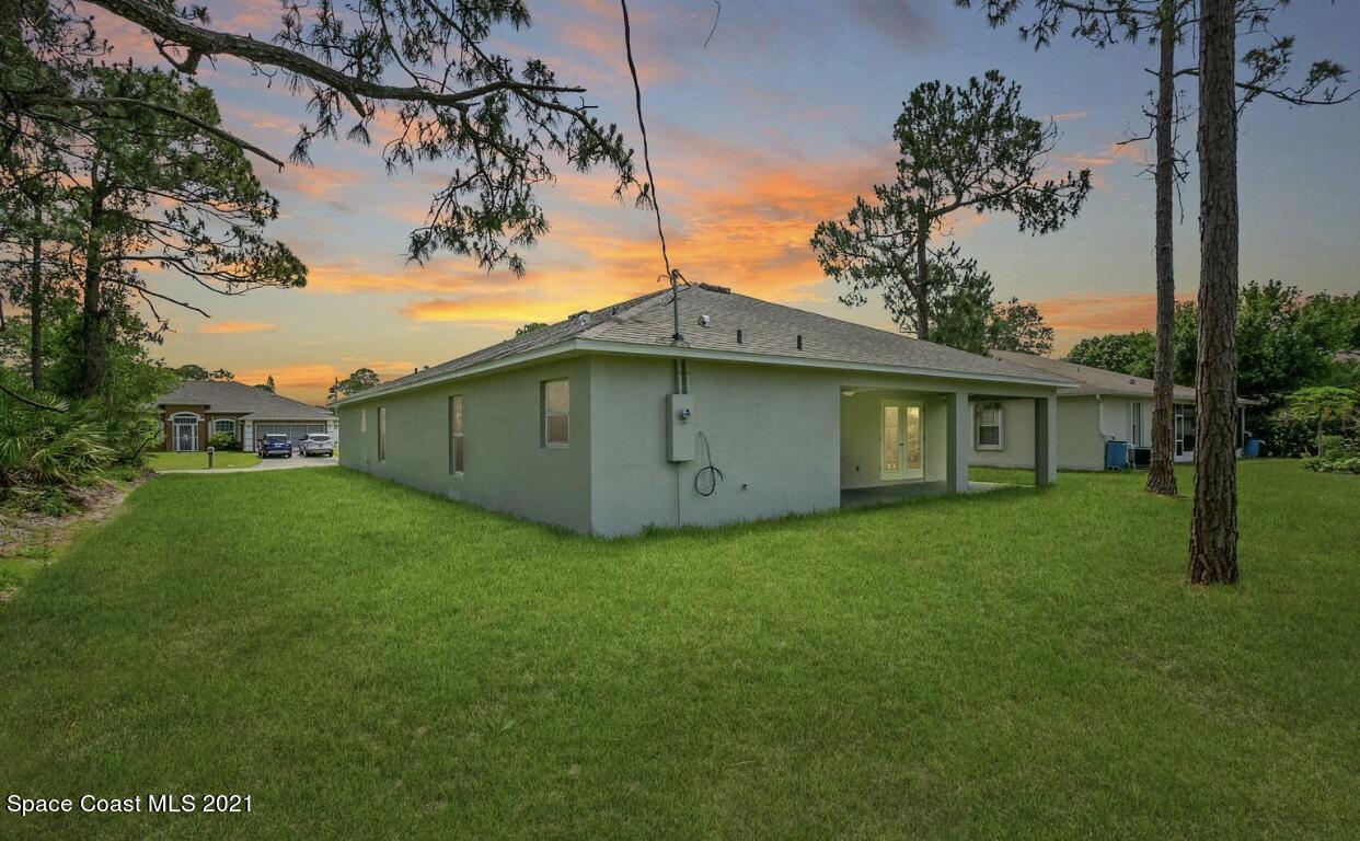 1738 Hydrangea Road Palm Bay, FL 32907 - Photo 3 of 20 a view of a house with a backyard