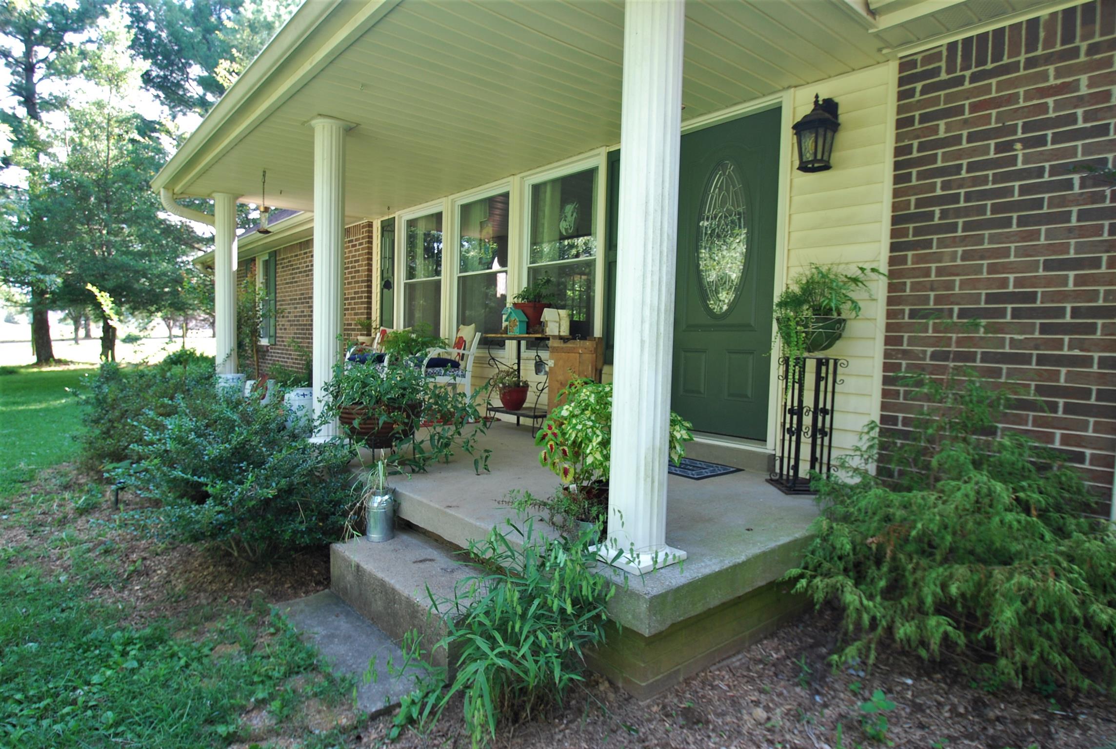 747 New Deal Potts Road Cottontown, TN 37048 - Photo 3 of 17 Enjoy your established shade from your rocking chair front porch