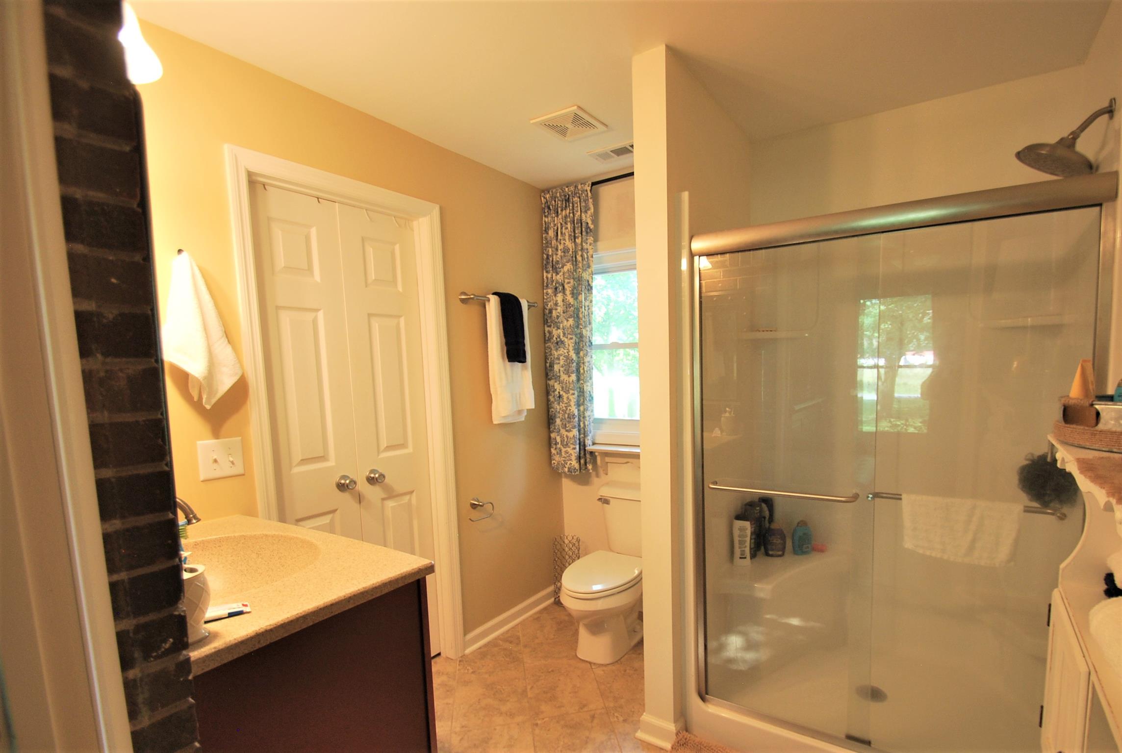 747 New Deal Potts Road Cottontown, TN 37048 - Photo 9 of 17 Master bath has tile, glass shower door and walk in closet