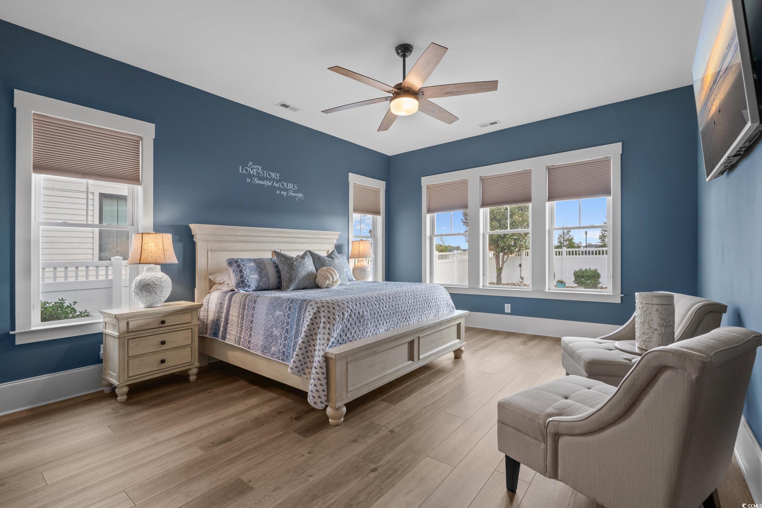 2604 Painted Trillium Court Myrtle Beach, SC 29579 - Photo 16 of 40 Bedroom featuring multiple windows, wood finished floors, and ceiling fan