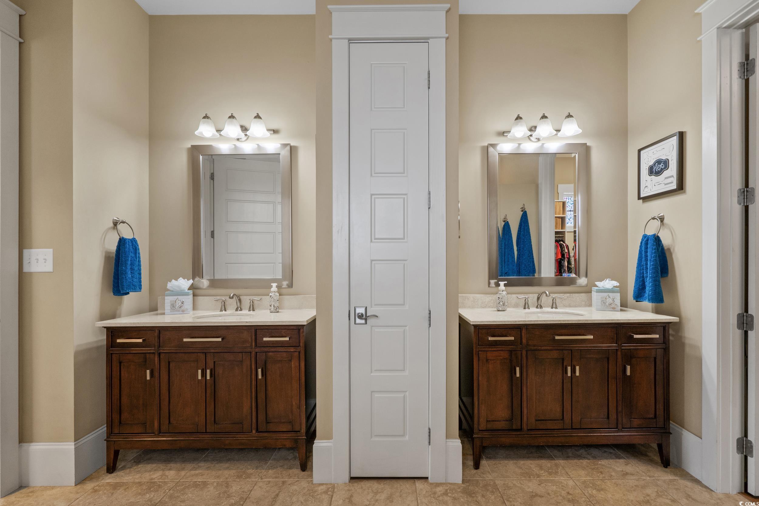 2604 Painted Trillium Court Myrtle Beach, SC 29579 - Photo 18 of 40 Bathroom featuring two vanities, a closet, and light tile patterned flooring