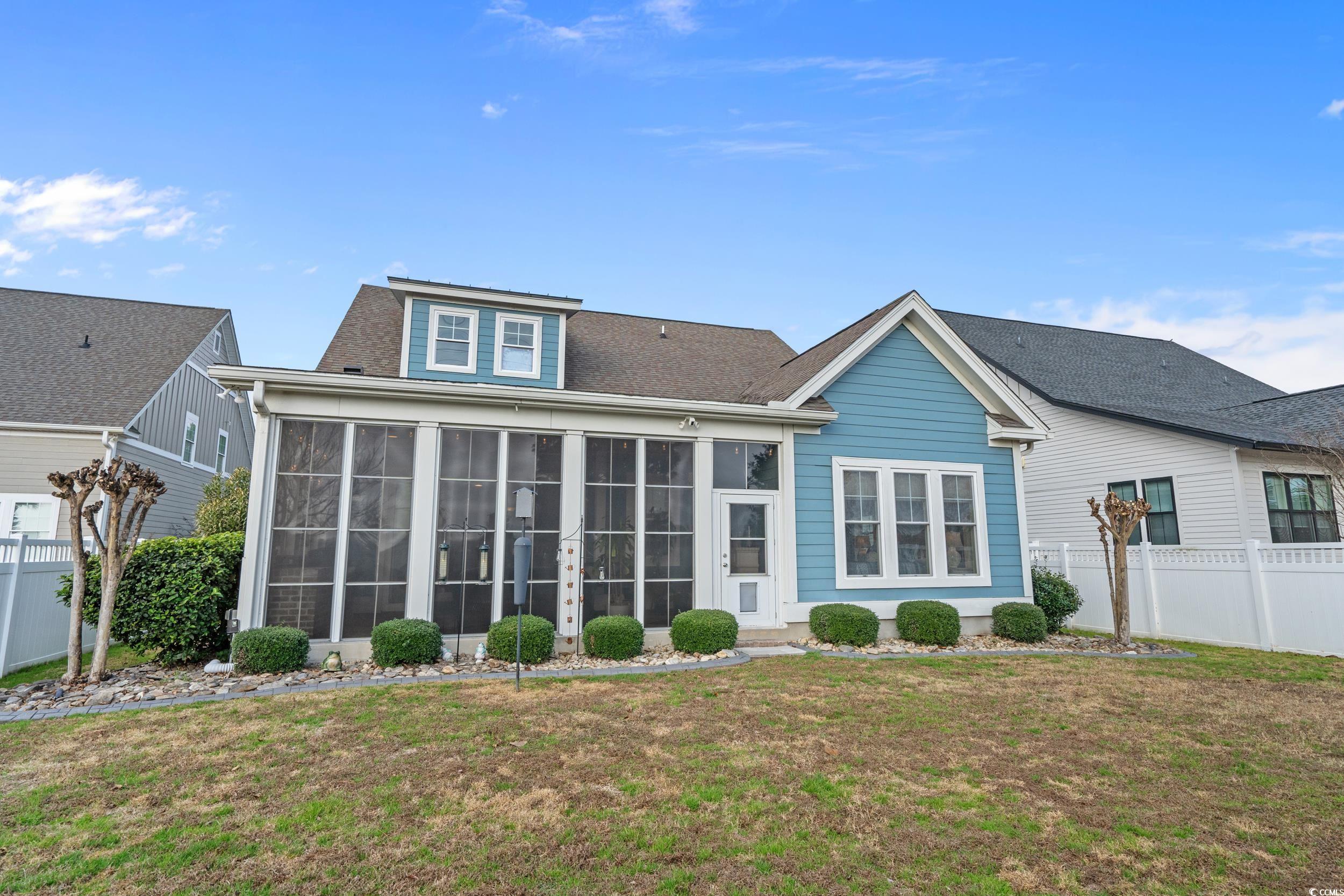 2604 Painted Trillium Court Myrtle Beach, SC 29579 - Photo 24 of 40 Rear view of house with a sunroom
