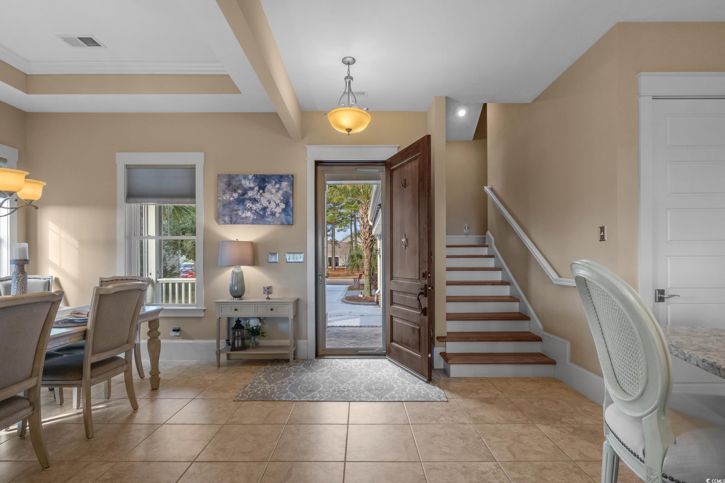 2604 Painted Trillium Court Myrtle Beach, SC 29579 - Photo 4 of 40 Foyer entrance with light tile patterned flooring and stairs