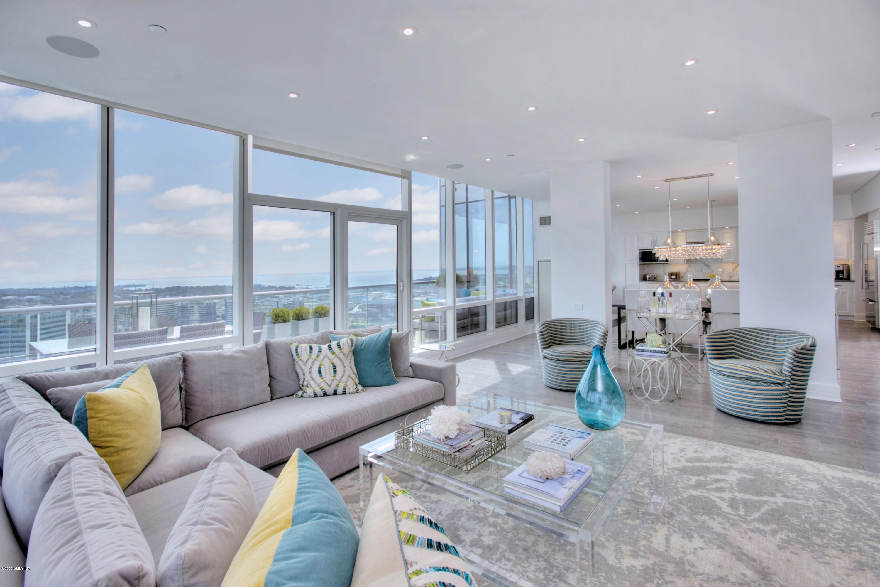 1 Broad Street, Unit PHD4 Stamford, CT 06901 - Photo 1 of 38 a living room with furniture and floor to ceiling windows