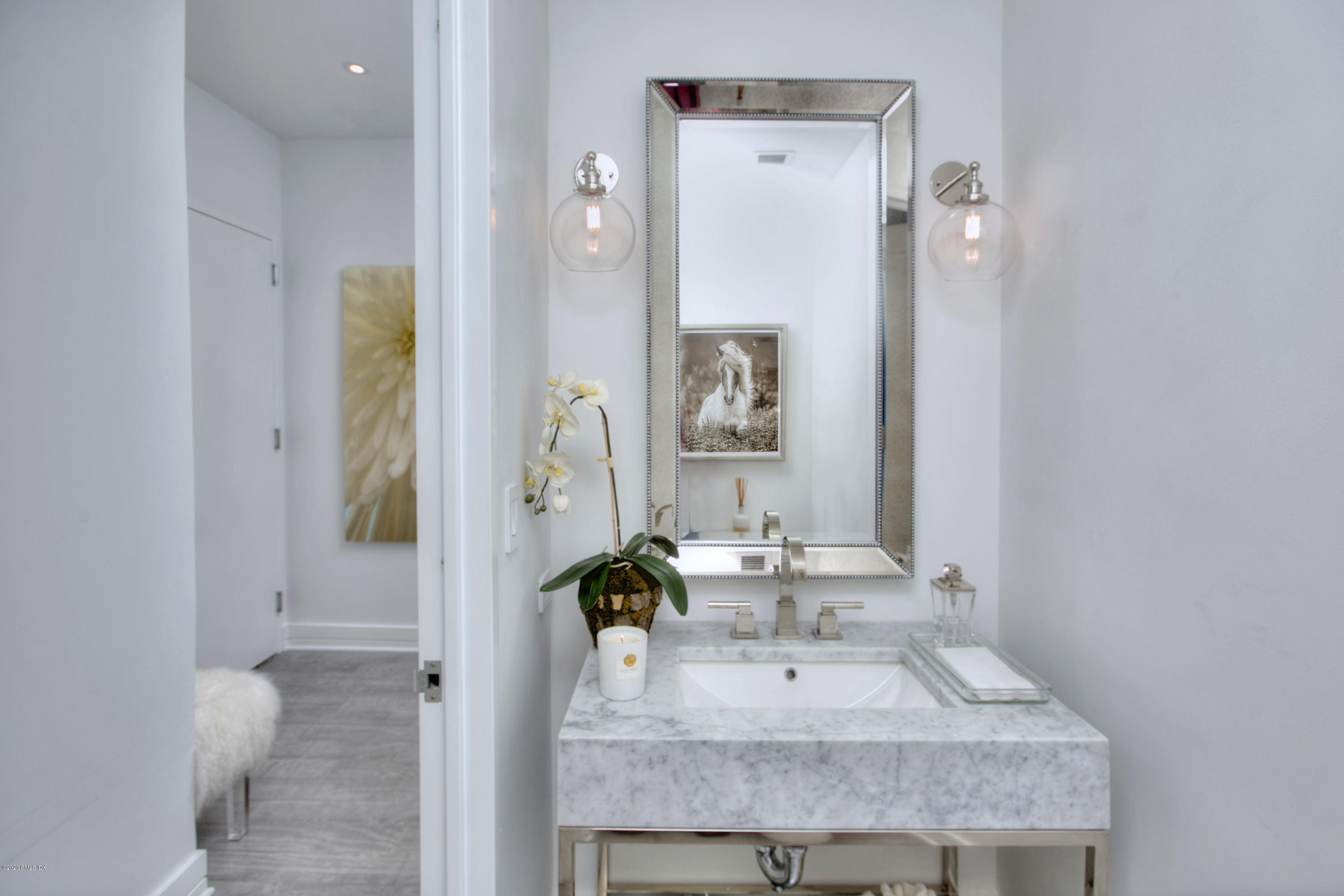 1 Broad Street, Unit PHD4 Stamford, CT 06901 - Photo 14 of 38 a bathroom with a sink vanity and a mirror