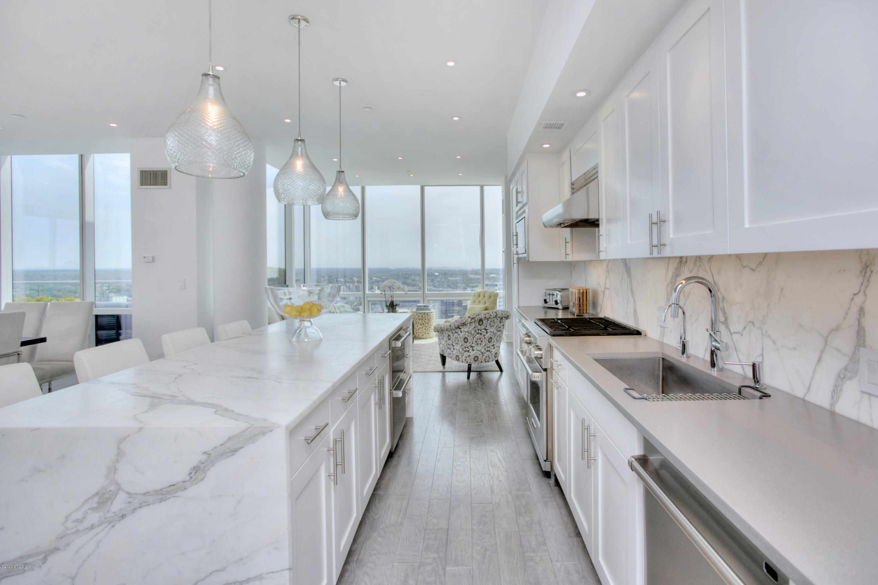 1 Broad Street, Unit PHD4 Stamford, CT 06901 - Photo 15 of 38 a kitchen with stainless steel appliances sink stove and cabinets