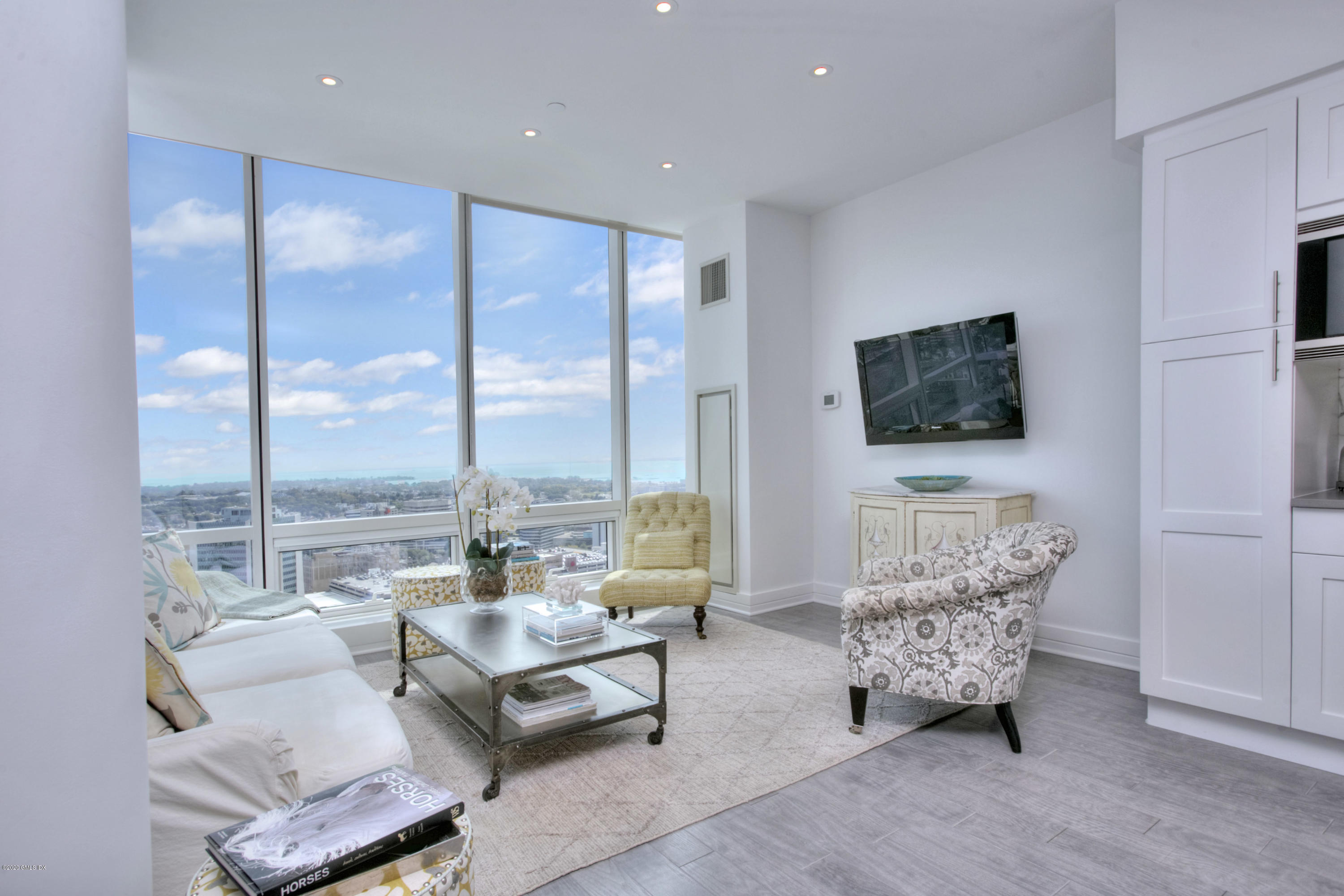 1 Broad Street, Unit PHD4 Stamford, CT 06901 - Photo 16 of 38 a living room with furniture and a flat screen tv