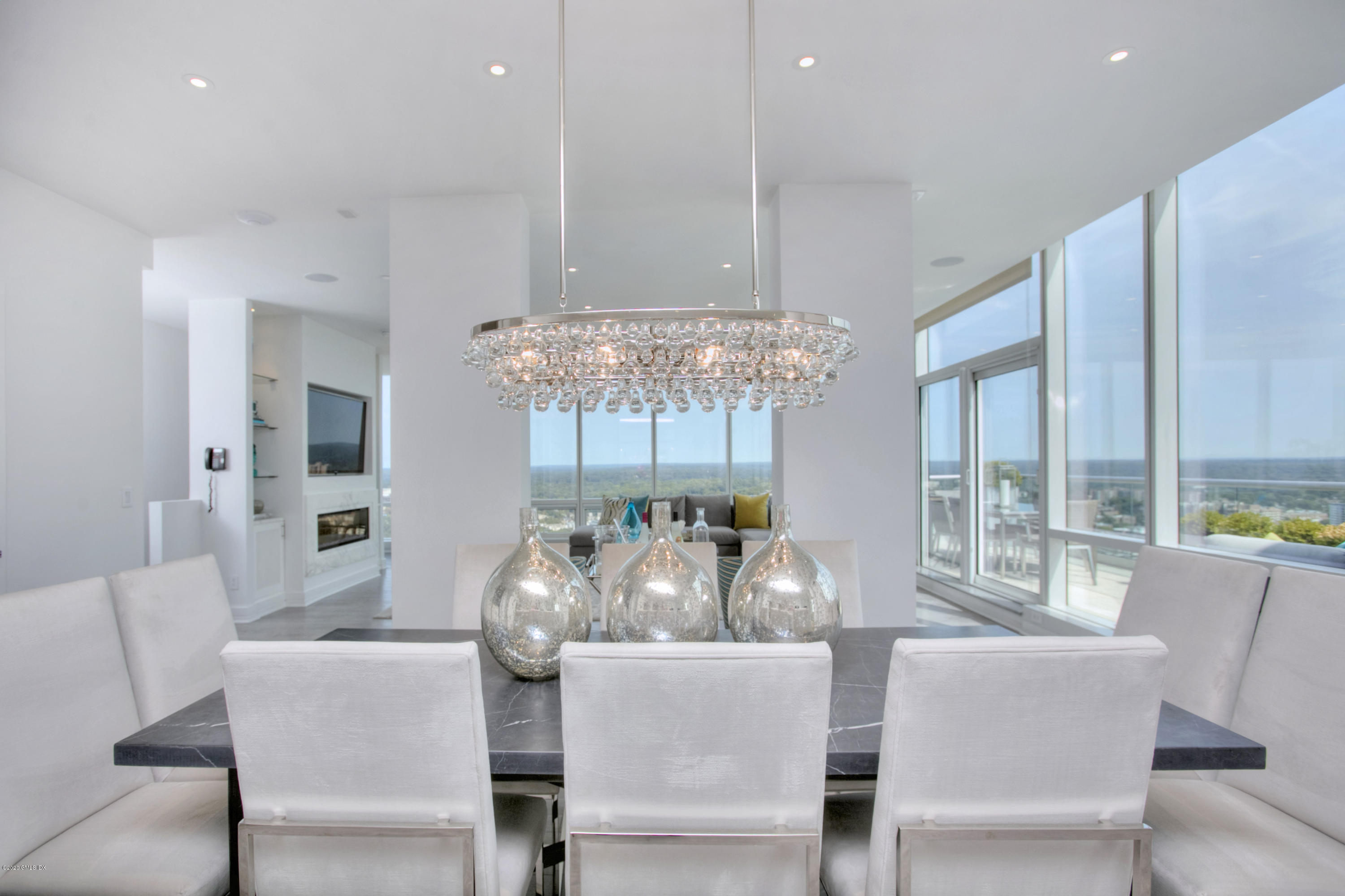 1 Broad Street, Unit PHD4 Stamford, CT 06901 - Photo 17 of 38 a dining room with furniture a chandelier and window