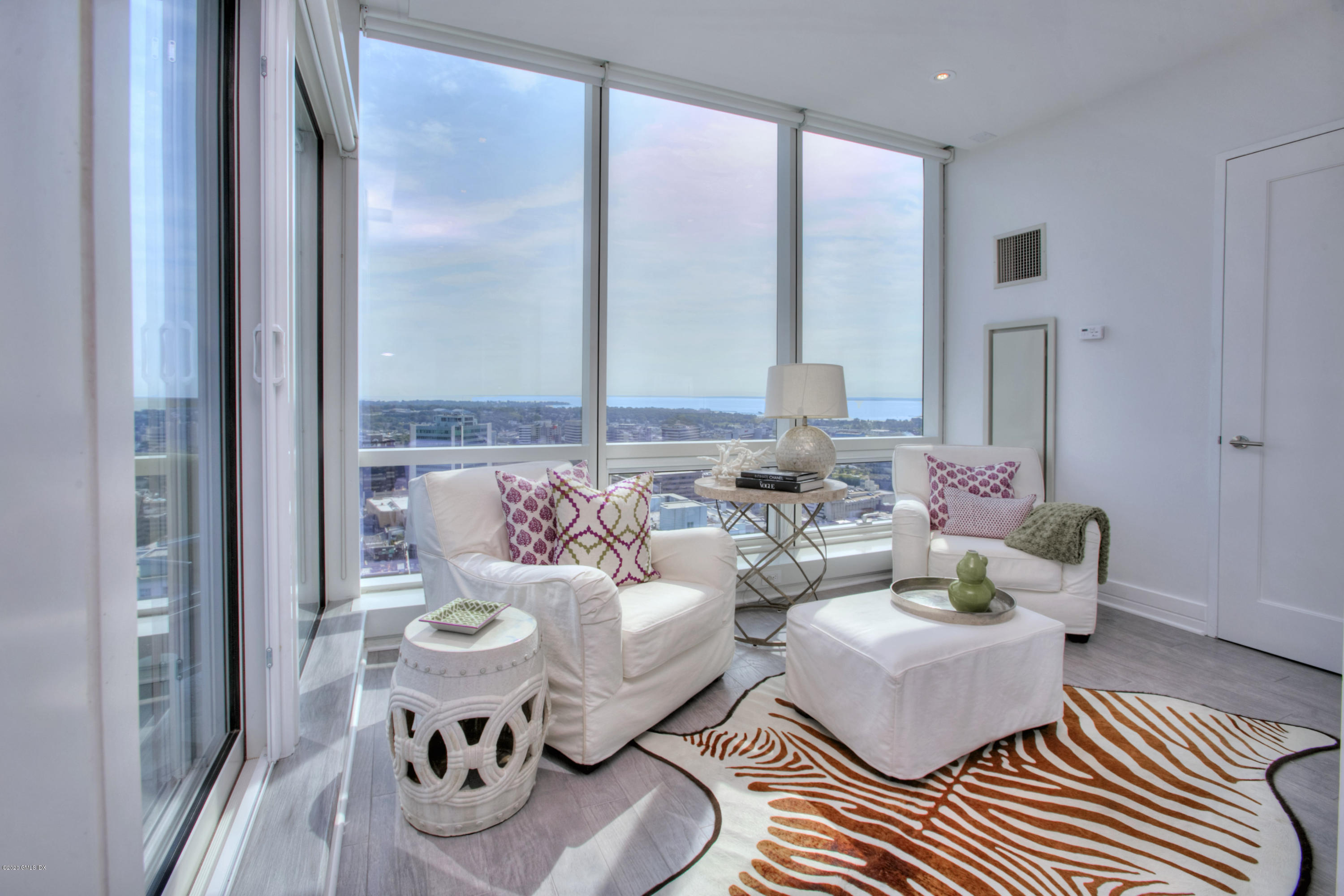 1 Broad Street, Unit PHD4 Stamford, CT 06901 - Photo 21 of 38 a living room with furniture and a large window