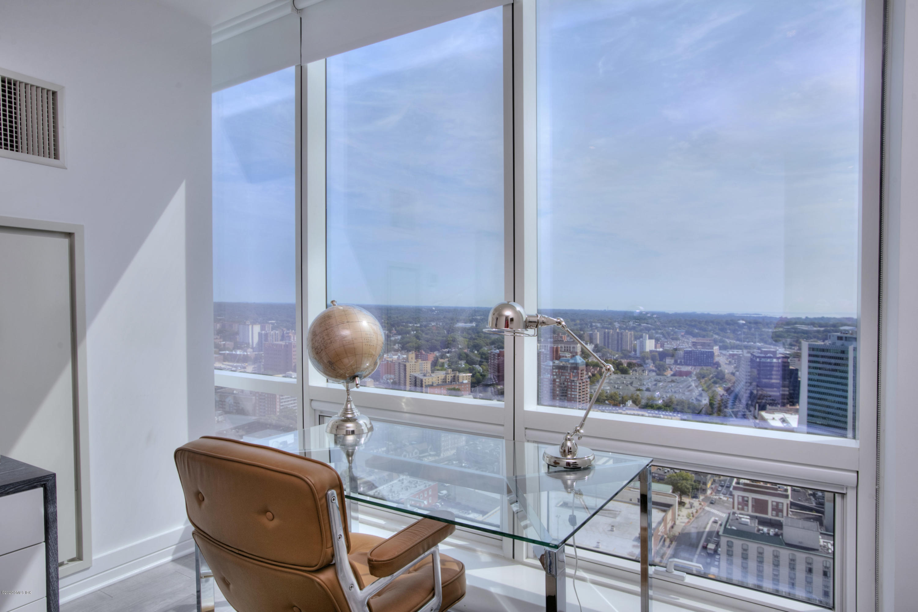 1 Broad Street, Unit PHD4 Stamford, CT 06901 - Photo 27 of 38 a view of a room with a table and chairs