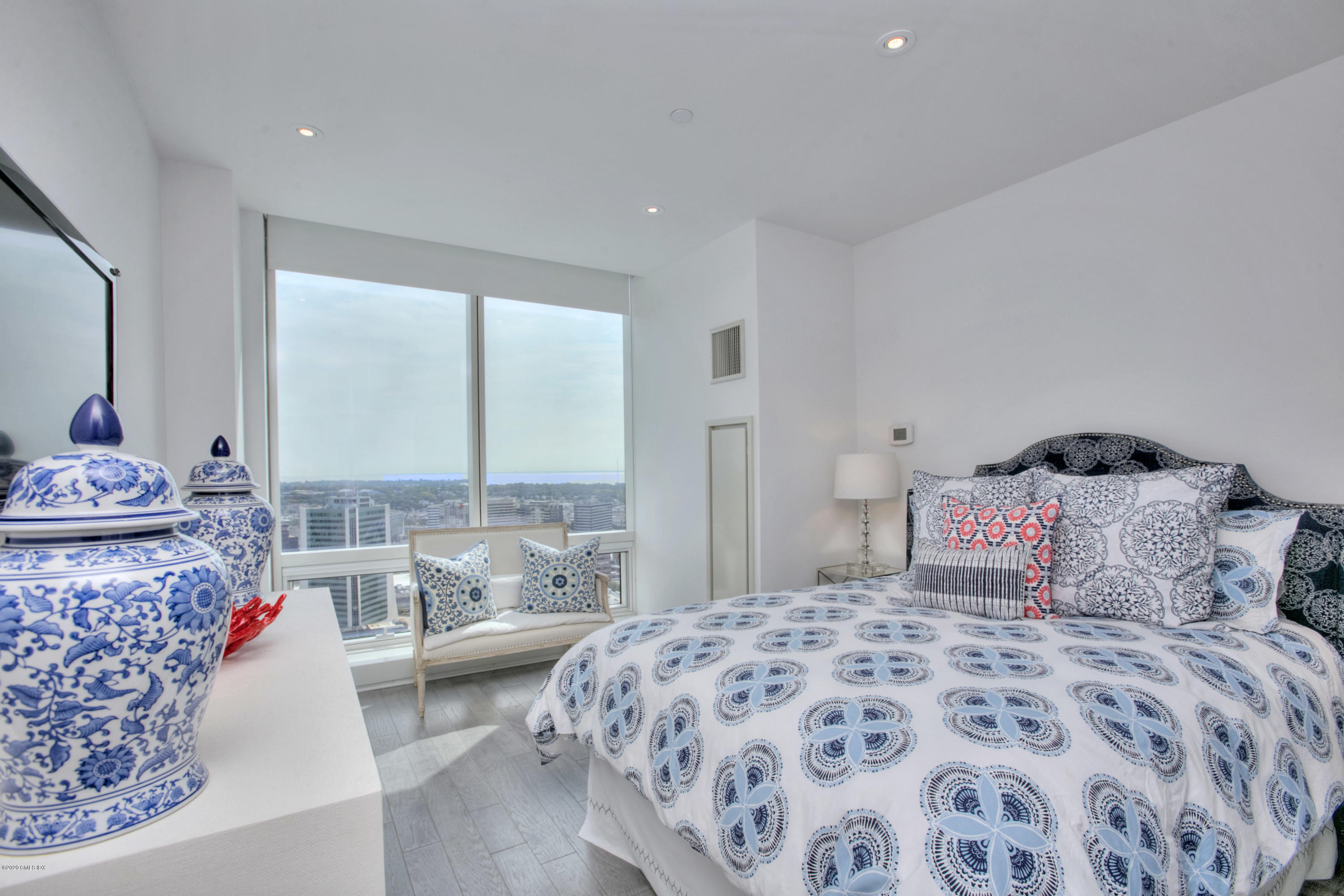 1 Broad Street, Unit PHD4 Stamford, CT 06901 - Photo 28 of 38 a bedroom with a large bed and a potted plant