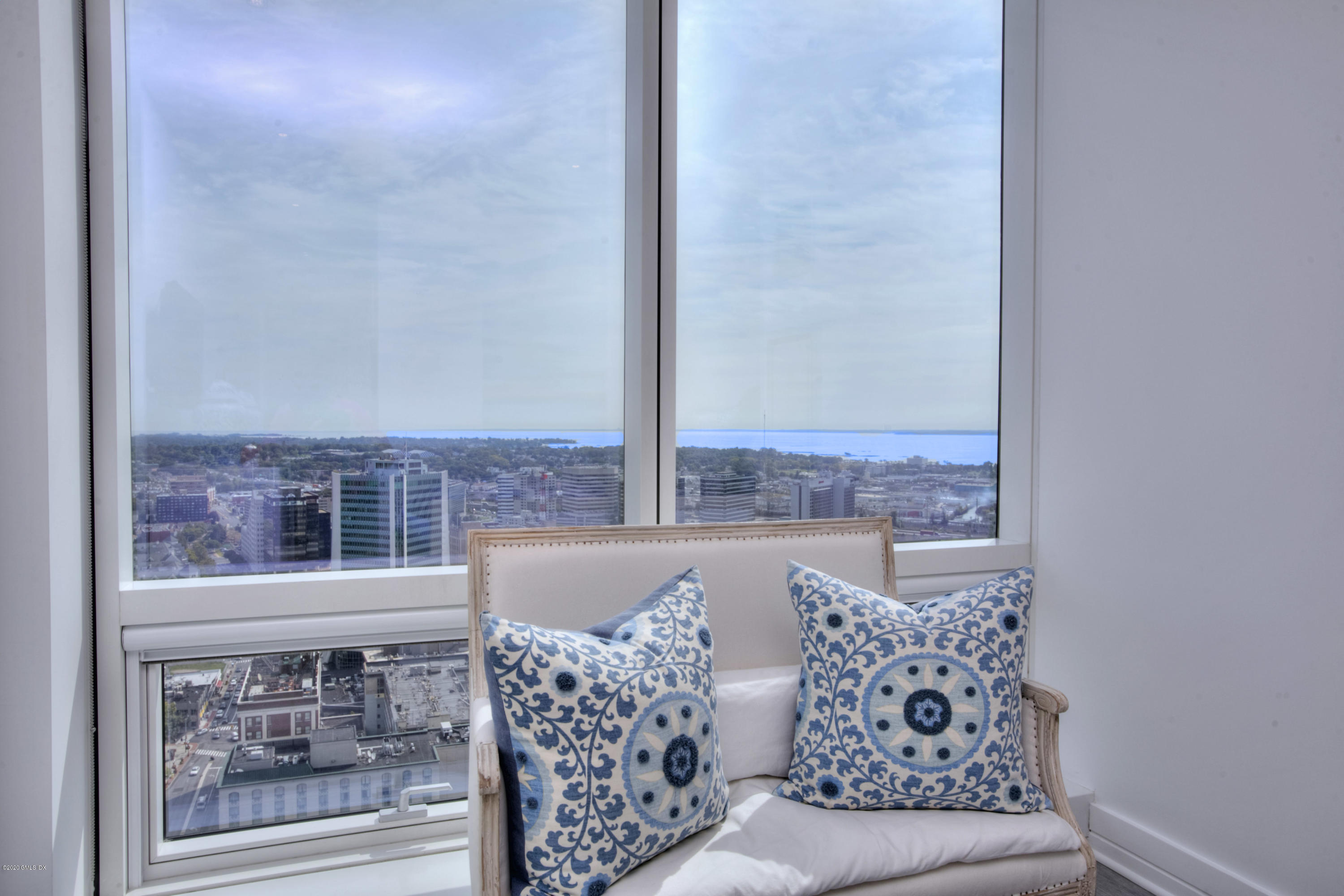1 Broad Street, Unit PHD4 Stamford, CT 06901 - Photo 29 of 38 a living room with furniture and a window