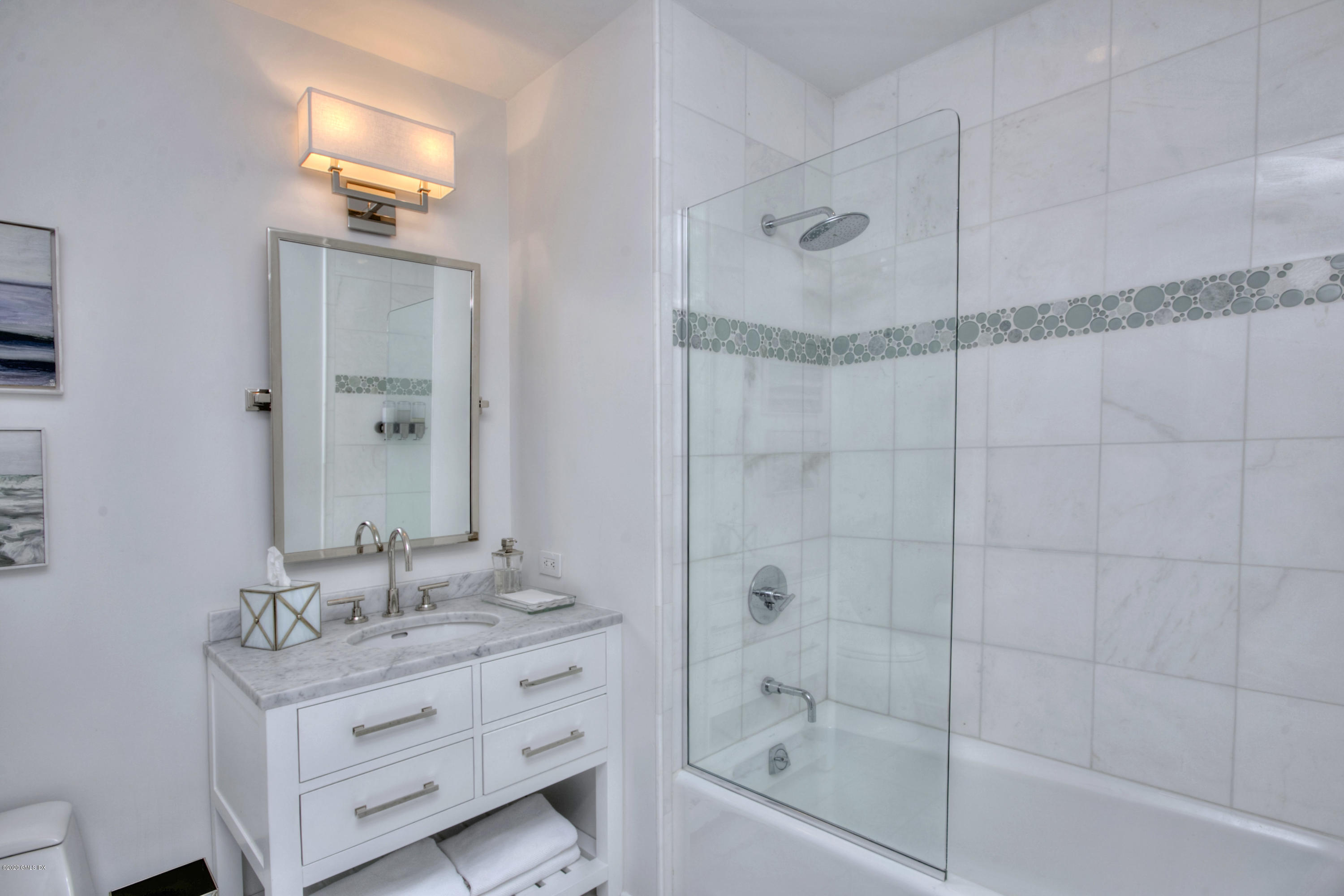 1 Broad Street, Unit PHD4 Stamford, CT 06901 - Photo 30 of 38 a bathroom with a shower sink and mirror