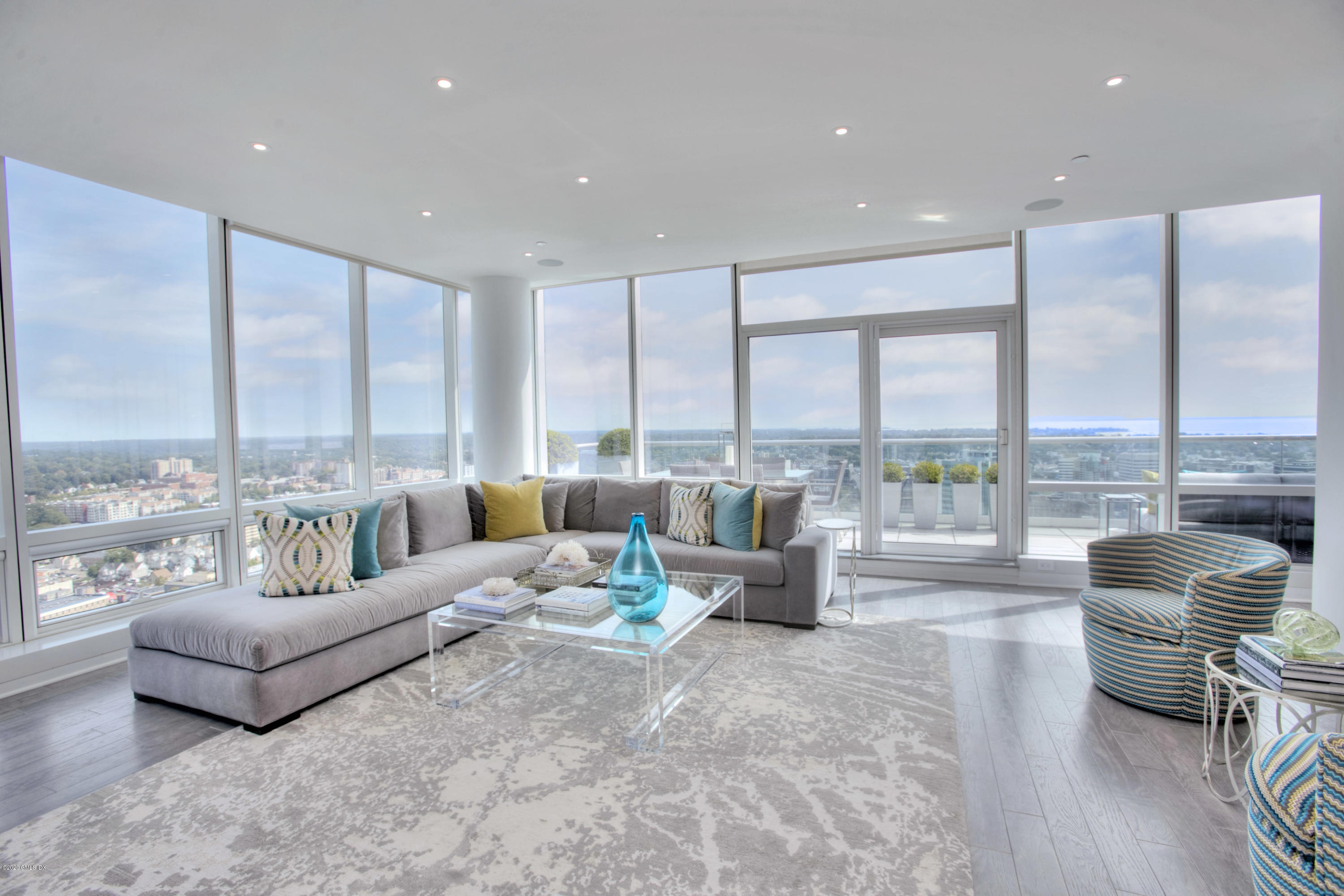 1 Broad Street, Unit PHD4 Stamford, CT 06901 - Photo 3 of 38 a living room with furniture and large windows