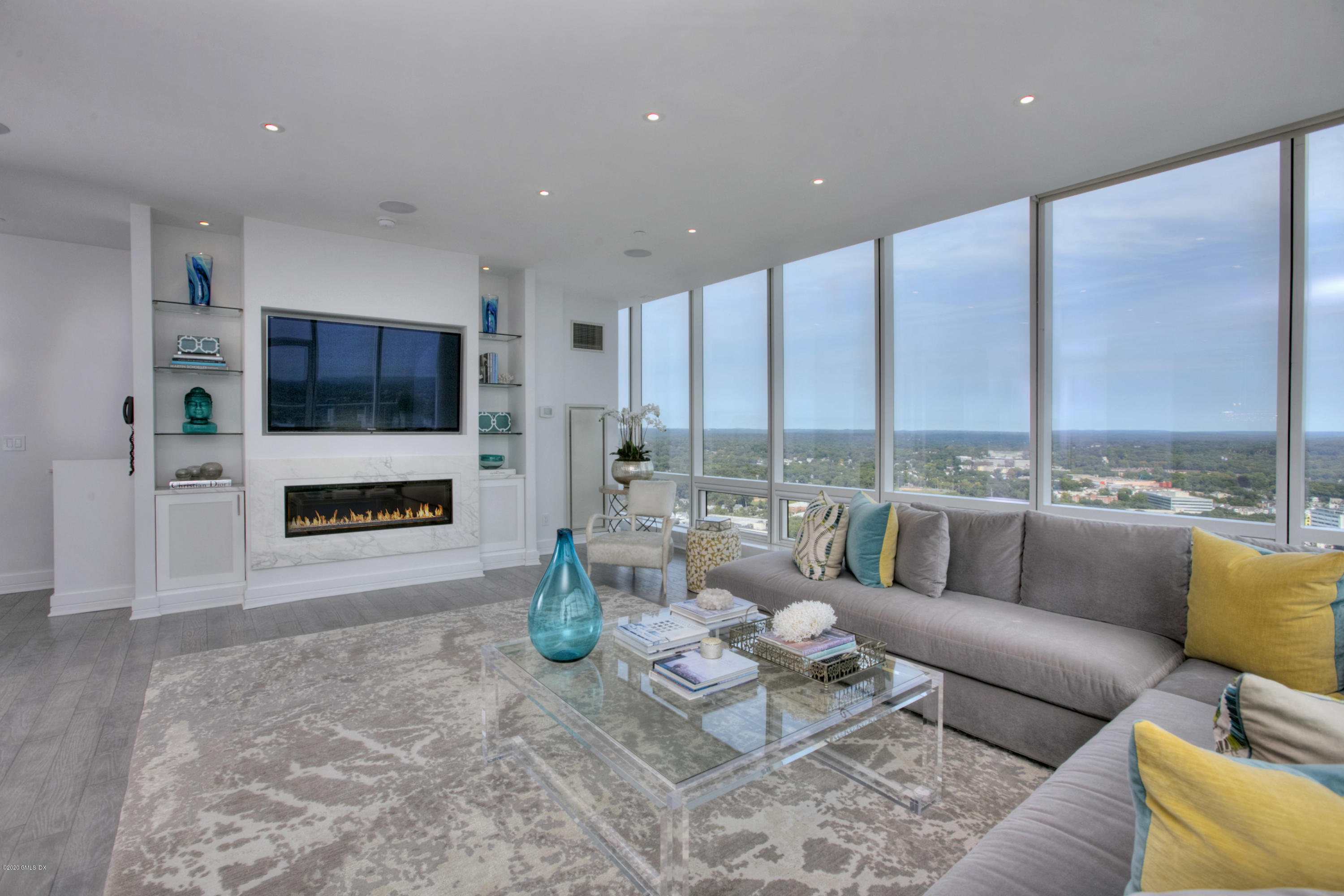 1 Broad Street, Unit PHD4 Stamford, CT 06901 - Photo 4 of 38 a living room with furniture and a flat screen tv