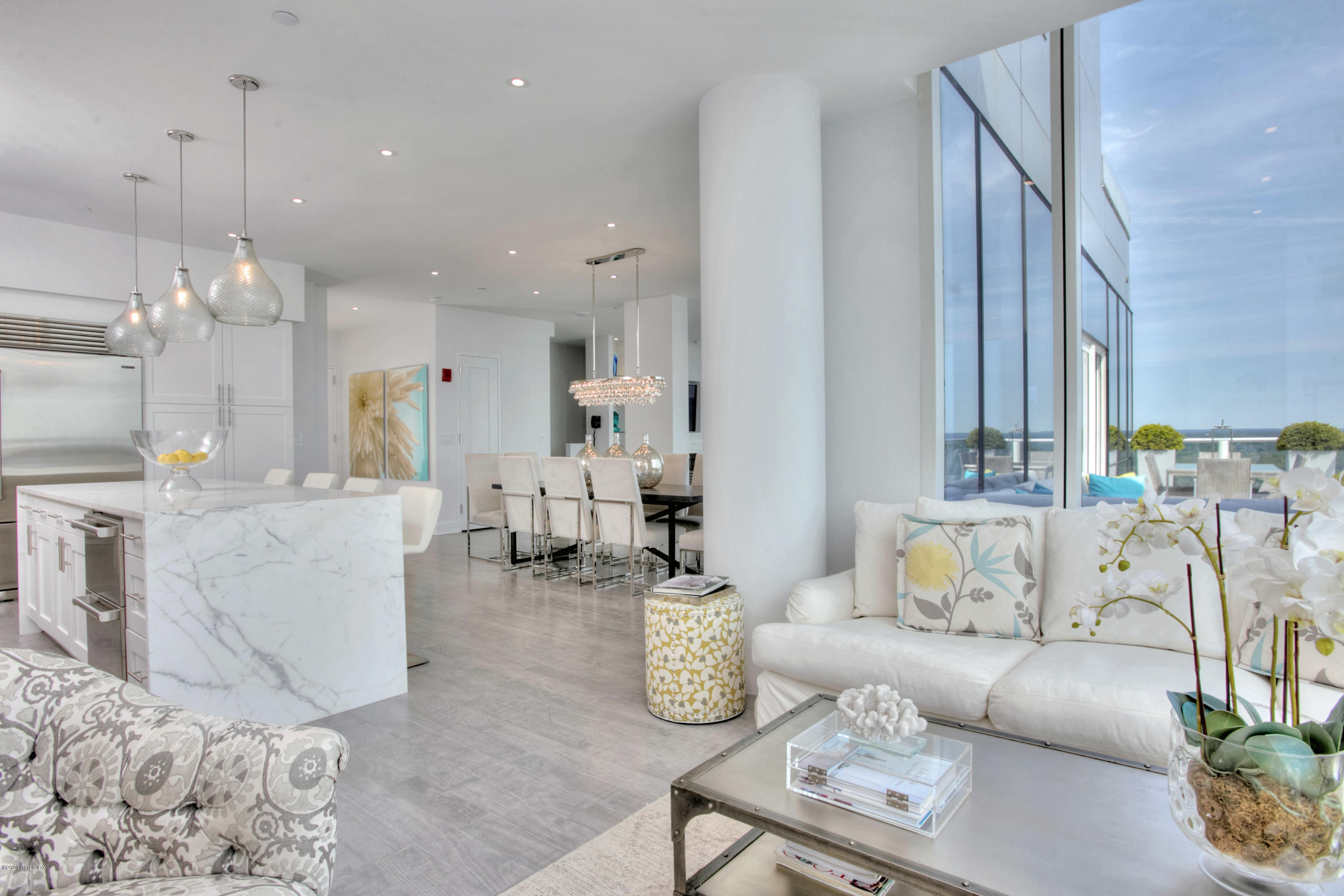1 Broad Street, Unit PHD4 Stamford, CT 06901 - Photo 5 of 38 a living room with furniture and a chandelier