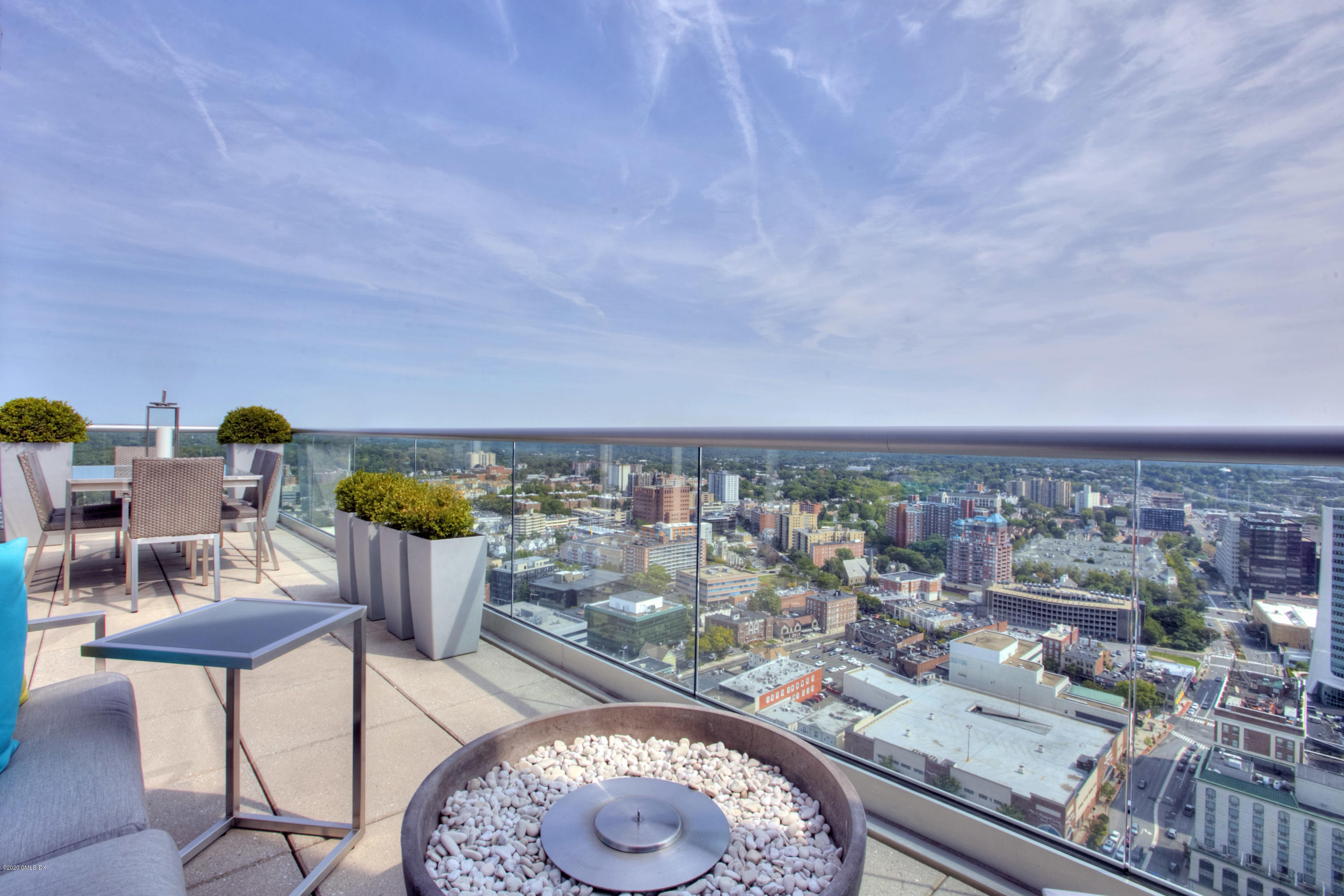 1 Broad Street, Unit PHD4 Stamford, CT 06901 - Photo 8 of 38 a view of a chairs and table in a terrace
