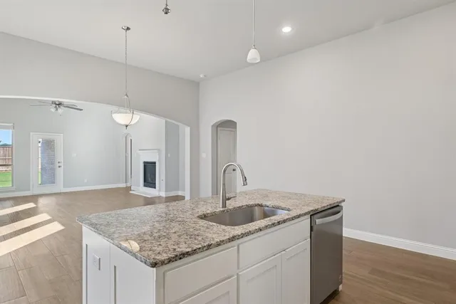 a kitchen with a sink and cabinets