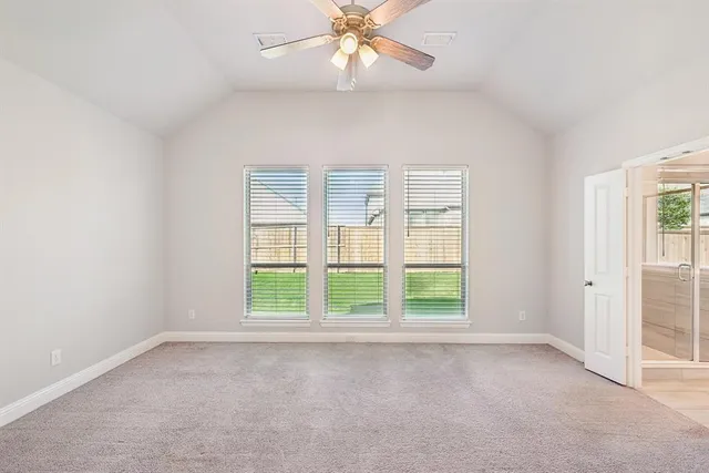 an empty room with a empty space and windows