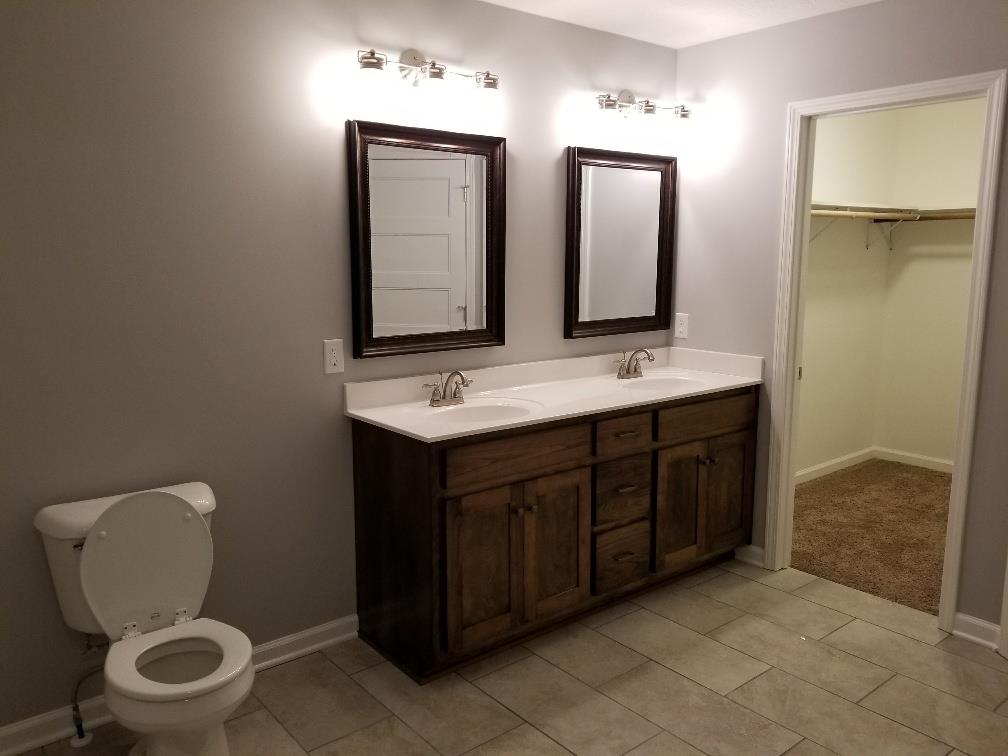 1680 Rock Bridge Road Bethpage, TN 37022 - Photo 18 of 19 a bathroom with a toilet sink and mirror