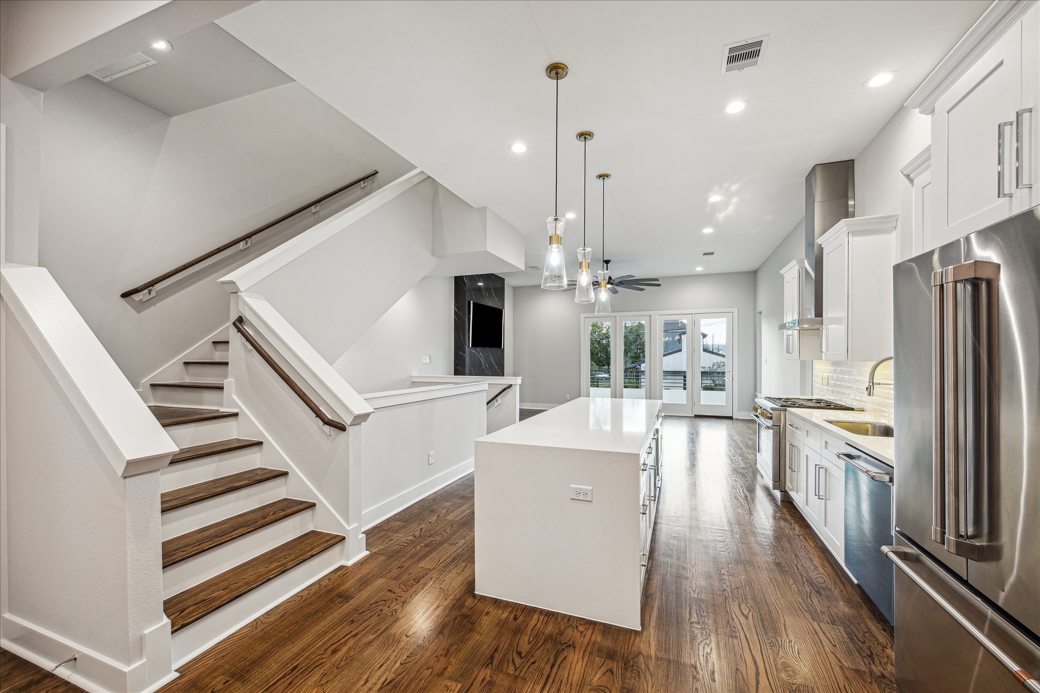 1518 Houston Avenue Houston, TX 77007 - Photo 17 of 40 a kitchen with stainless steel appliances a refrigerator and wooden floor