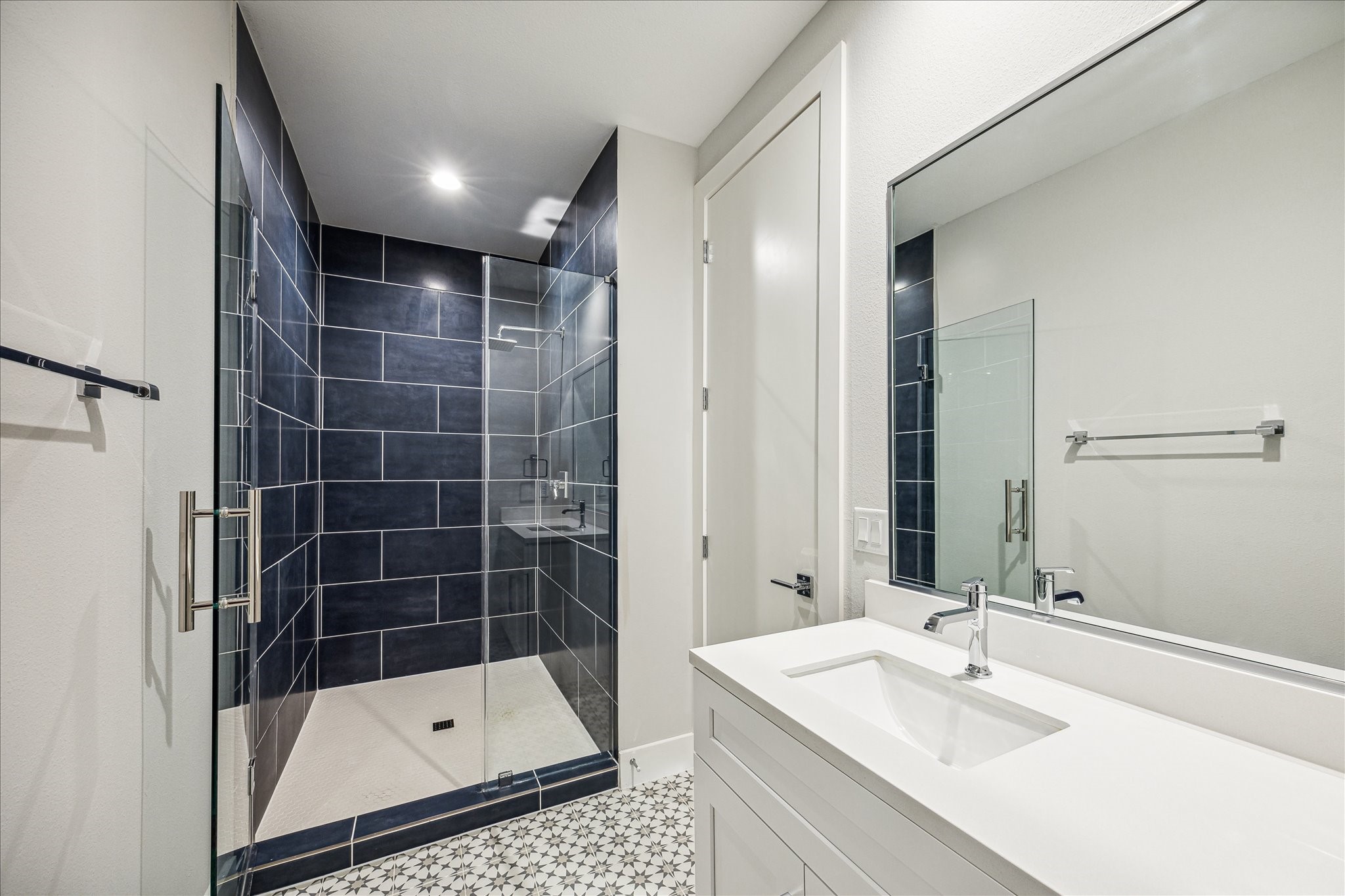 1518 Houston Avenue Houston, TX 77007 - Photo 23 of 40 a bathroom with a shower sink and mirror