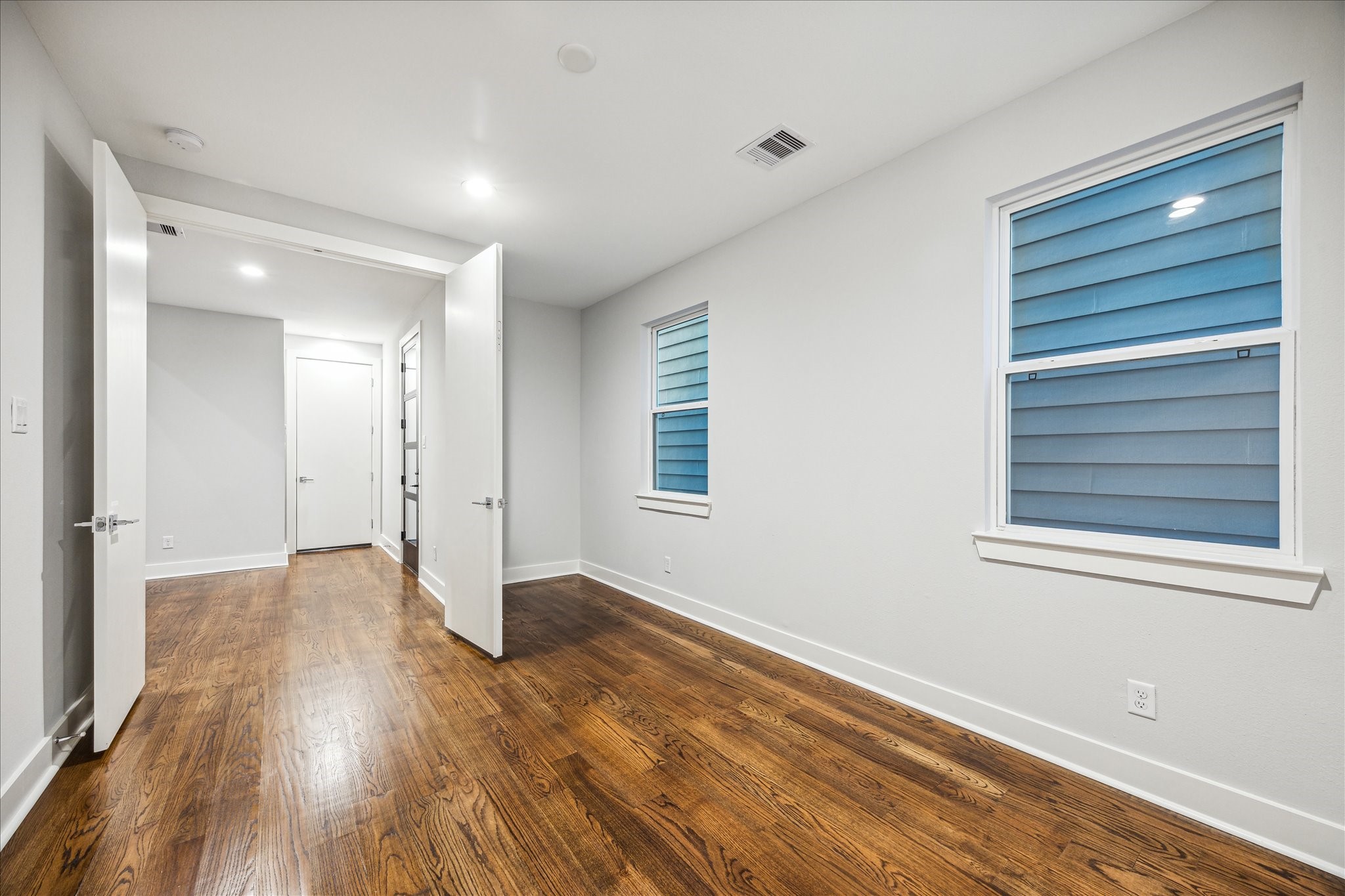 1518 Houston Avenue Houston, TX 77007 - Photo 26 of 40 a view of an empty room with wooden floor and a window