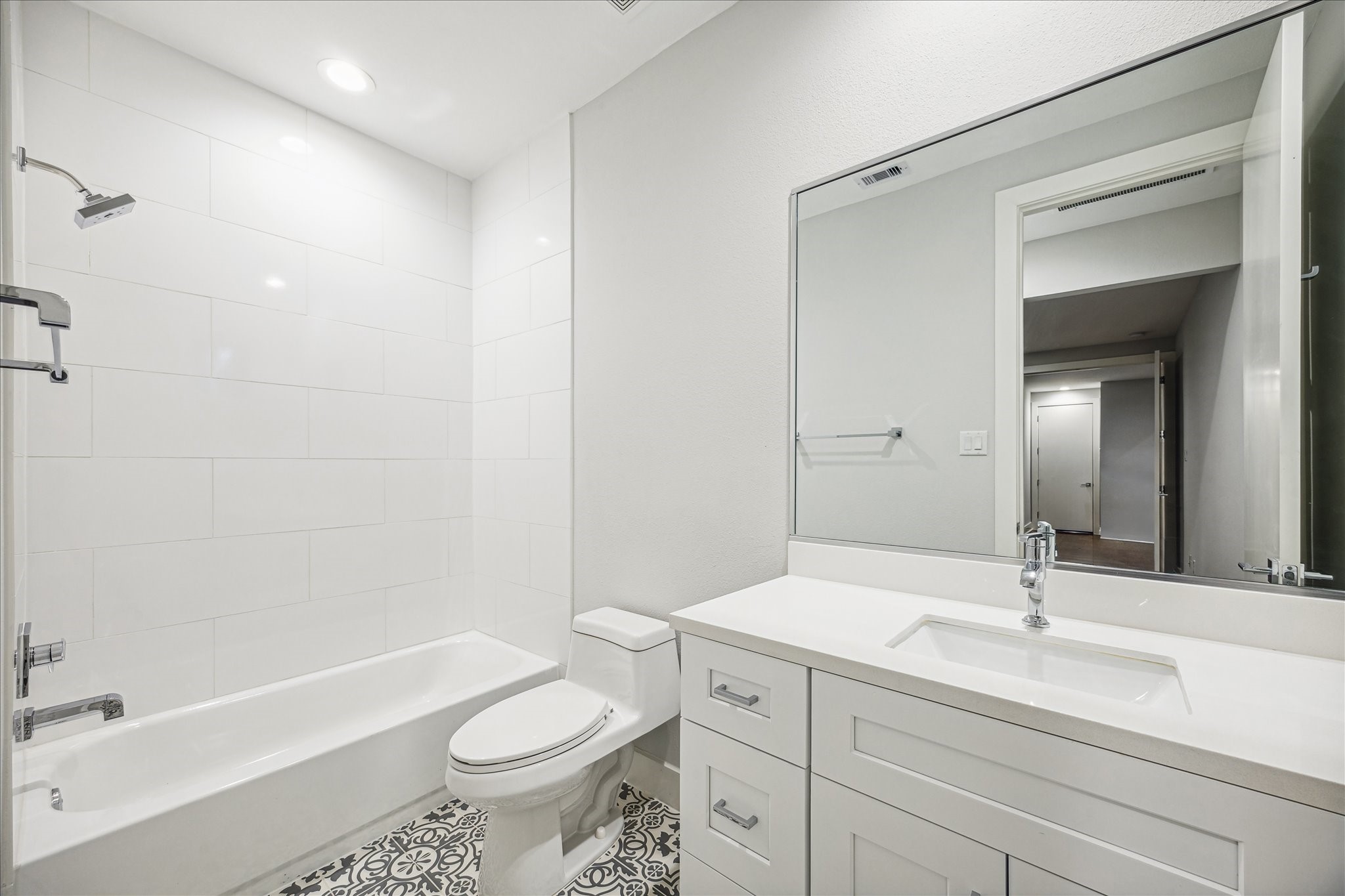 1518 Houston Avenue Houston, TX 77007 - Photo 30 of 40 a bathroom with a sink a toilet a mirror and shower