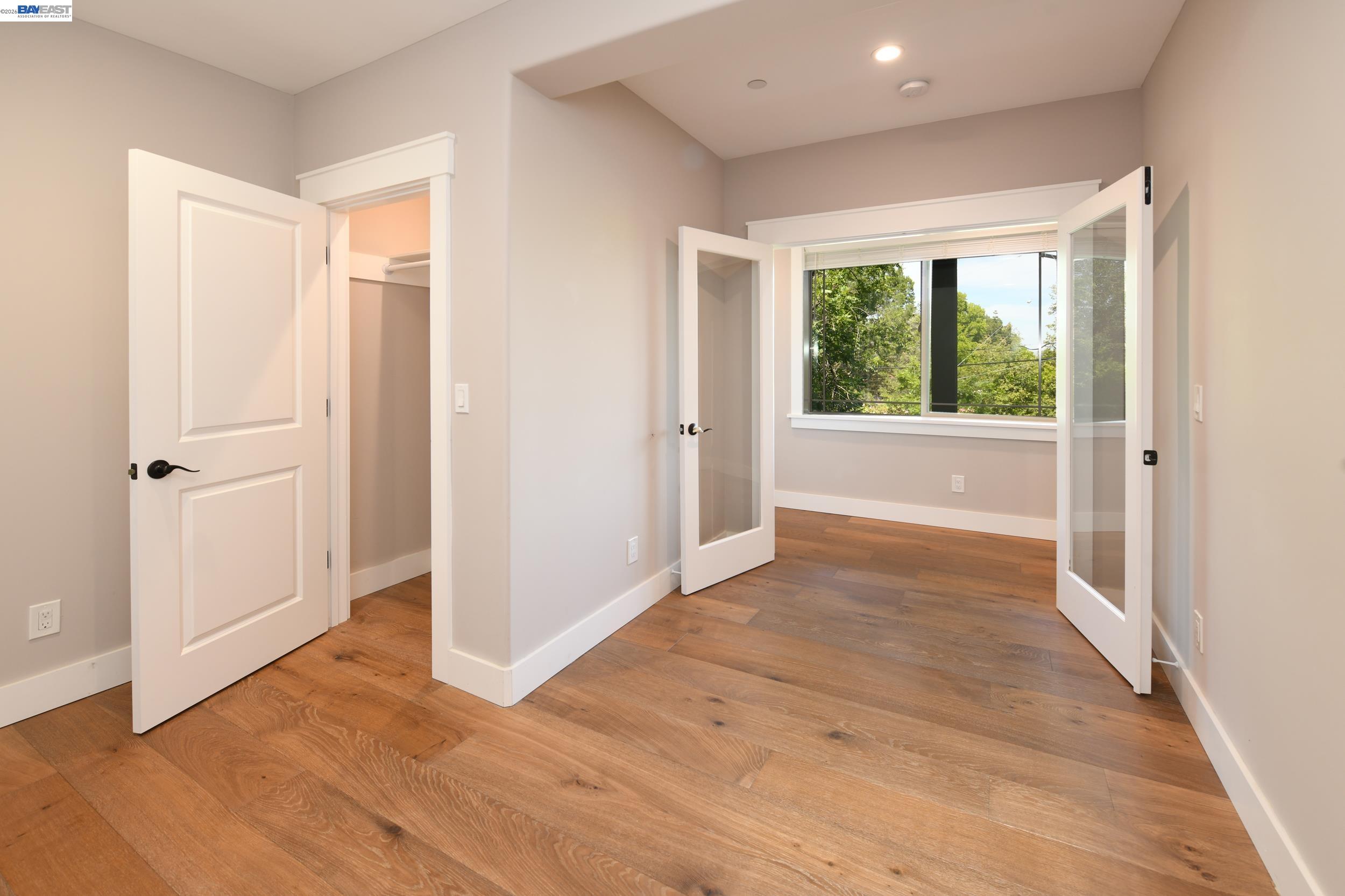 1516 Pleasant Hill Road Lafayette, CA 94549 - Photo 25 of 38 a view of an empty room with wooden floor and a window