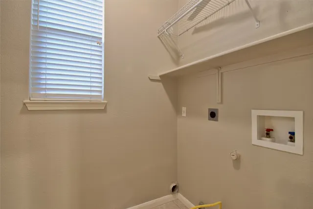 a bathroom with a shower and a window