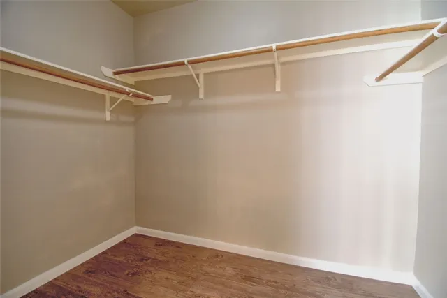 a view of a room with shelf on the wall