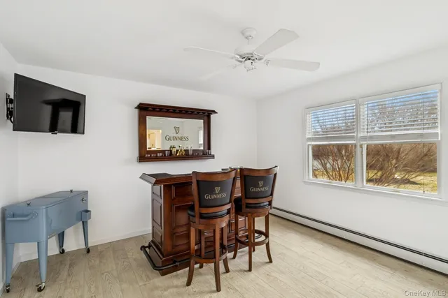 a dining room with furniture and window