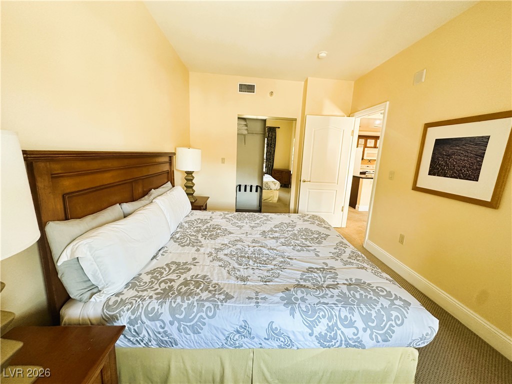 30 Strada Di Villaggio, Unit 531 Henderson, NV 89011 - Photo 19 of 42 Bedroom with light colored carpet and a closet