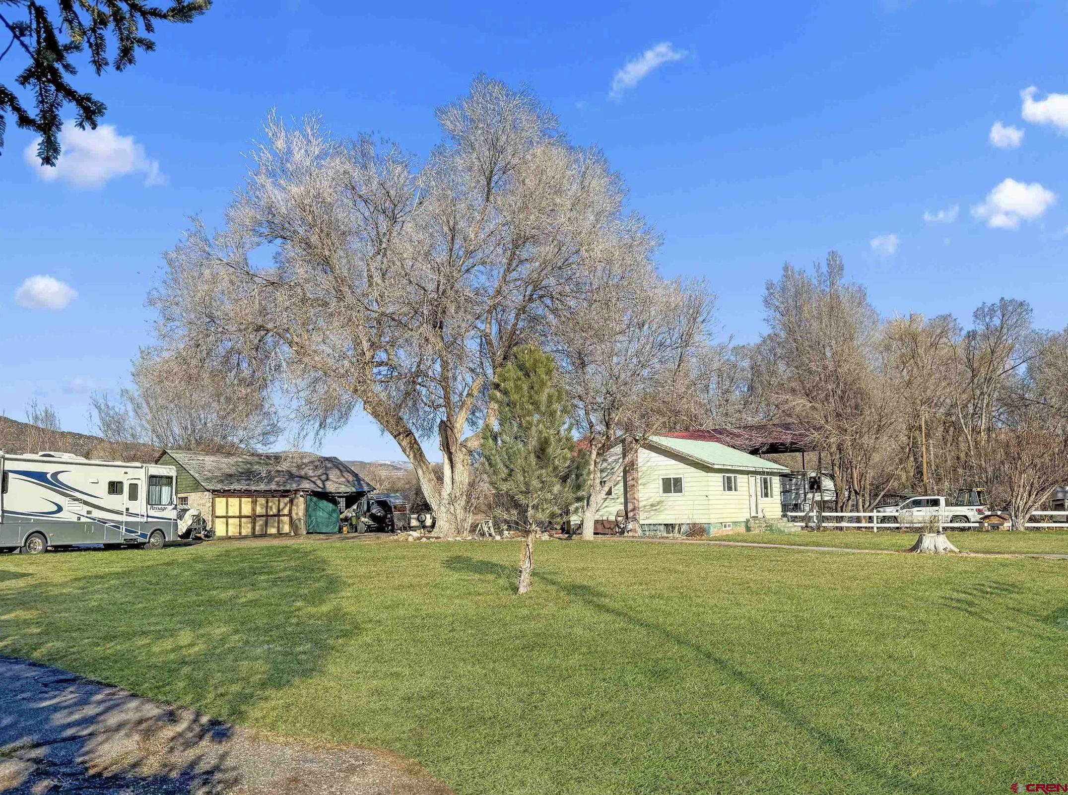 458 Price Road Paonia, CO 81428 - Photo 6 of 44 a view of house with garden space and trees