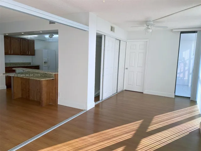 a view of a kitchen from the hallway