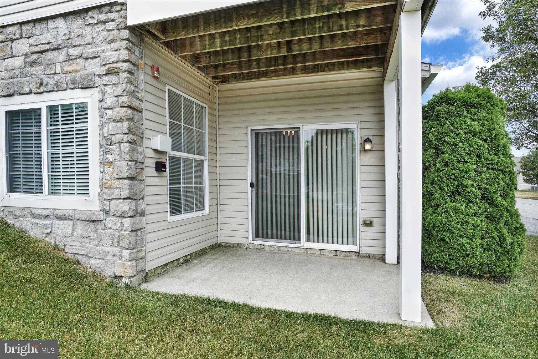 1402 Marshview Road, Unit 1402 Stewartstown, PA 17363 - Photo 6 of 31 And a slider leading to the covered side patio