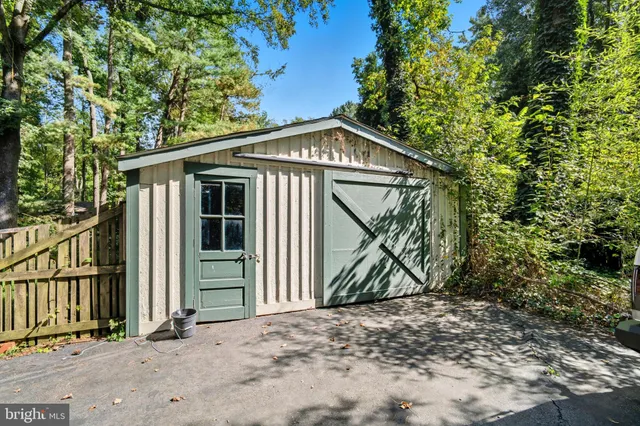 a view of a house with a tree in the background
