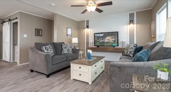 a living room with furniture and a large window