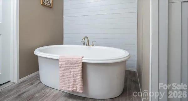 a close view of a sink and dishwasher in a bathroom