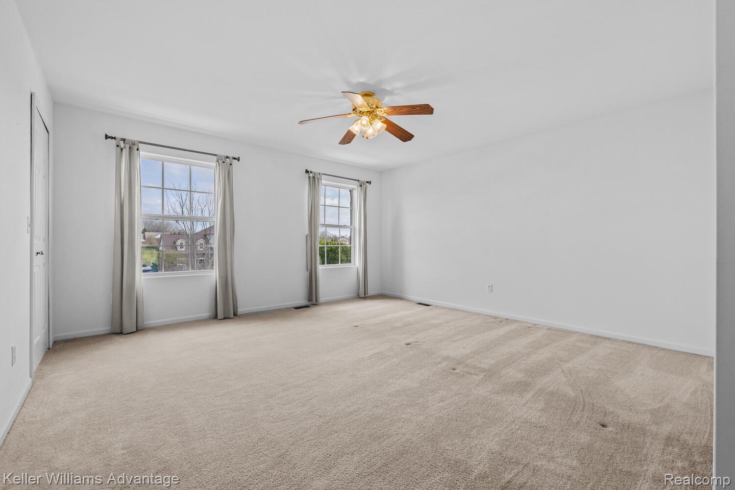 4100 Norwich Court Rochester, MI 48306 - Photo 42 of 72 Empty room featuring a ceiling fan and light colored carpet