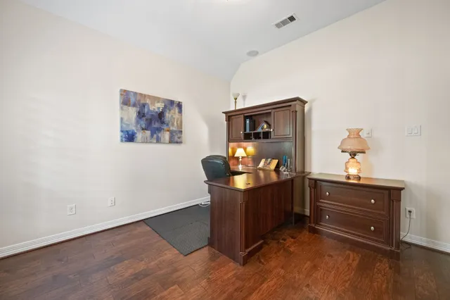 a room with furniture and wooden floor