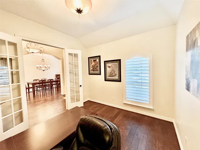 a view of a livingroom with furniture and a window
