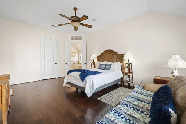 a bed room with a bed and a chandelier