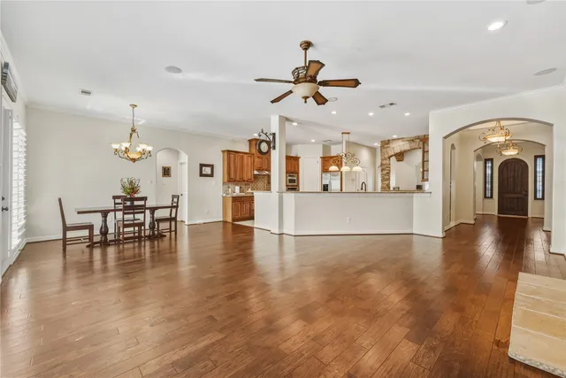 a view of a kitchen with a sink and a fireplace