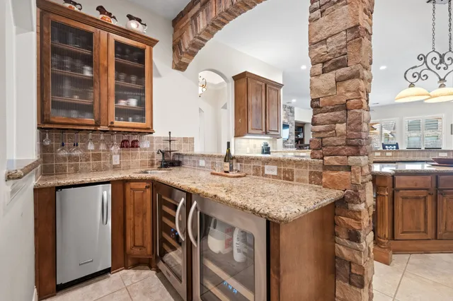 a kitchen with stainless steel appliances granite countertop a sink and cabinets