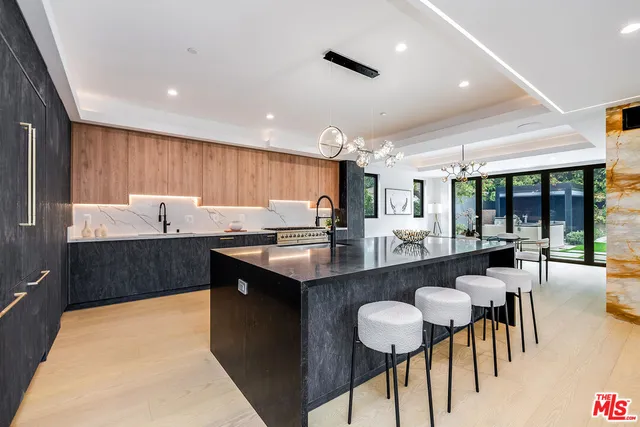 a spacious bedroom with a bed and a couch