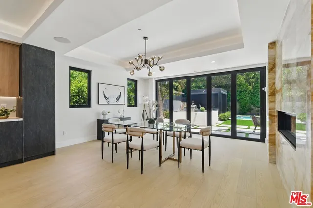 a kitchen with stainless steel appliances granite countertop a sink and a stove